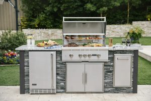 Outdoor kitchen must haves: stainless steel grill station with refrigerator 
